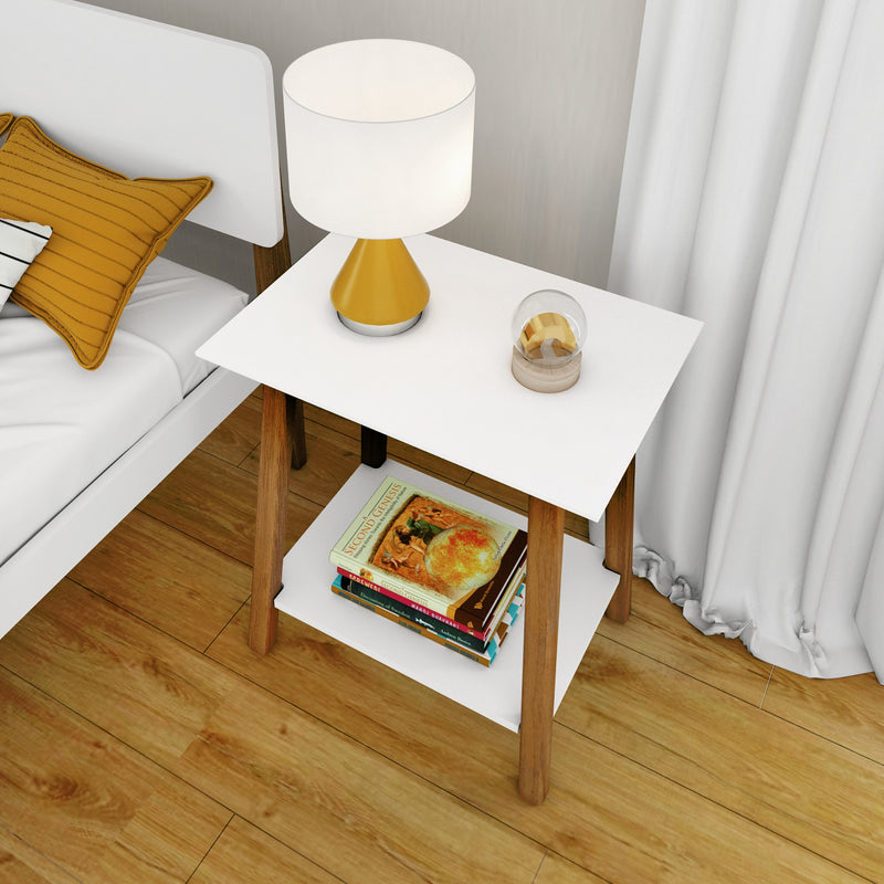 Modern white and wood bedside table (nightstand) with yellow table lamp, glass globe decor and stacked books on lower shelf in contemporary bedroom