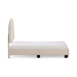 Modern beige upholstered bed frame with white mattress, side view.