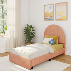 Cozy bedroom with orange bed frame, decorative pillows, and indoor plant by window.