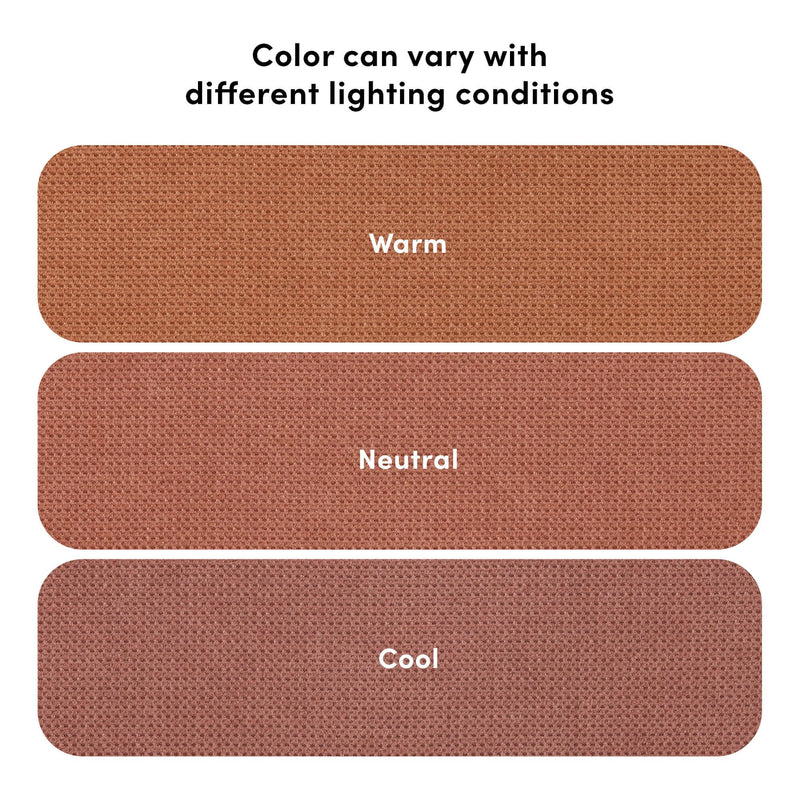 Rust-colored woven fabric color swatches labeled Warm, Neutral, Cool with visible texture and the note “Color can vary with different lighting conditions” illustrating lighting effects on hue