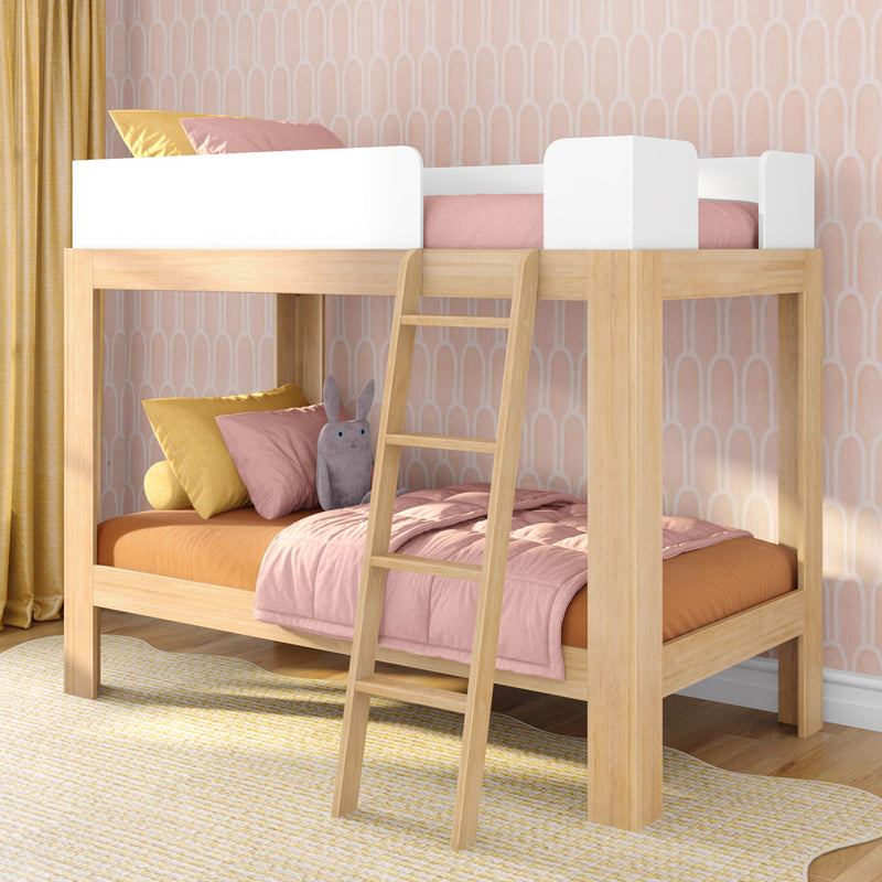 Modern natural wood bunk bed loft for kids with pink bedding, ladder, yellow pillows and pastel patterned nursery wallpaper