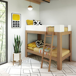 Modern wooden bunk bed with colorful bedding in a bright room, featuring a houseplant and geometric artwork.