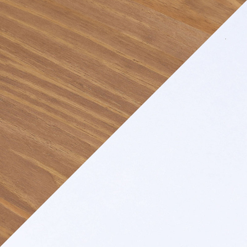 Diagonal white paper on oak wood table with warm wood grain texture — minimalist workspace background
