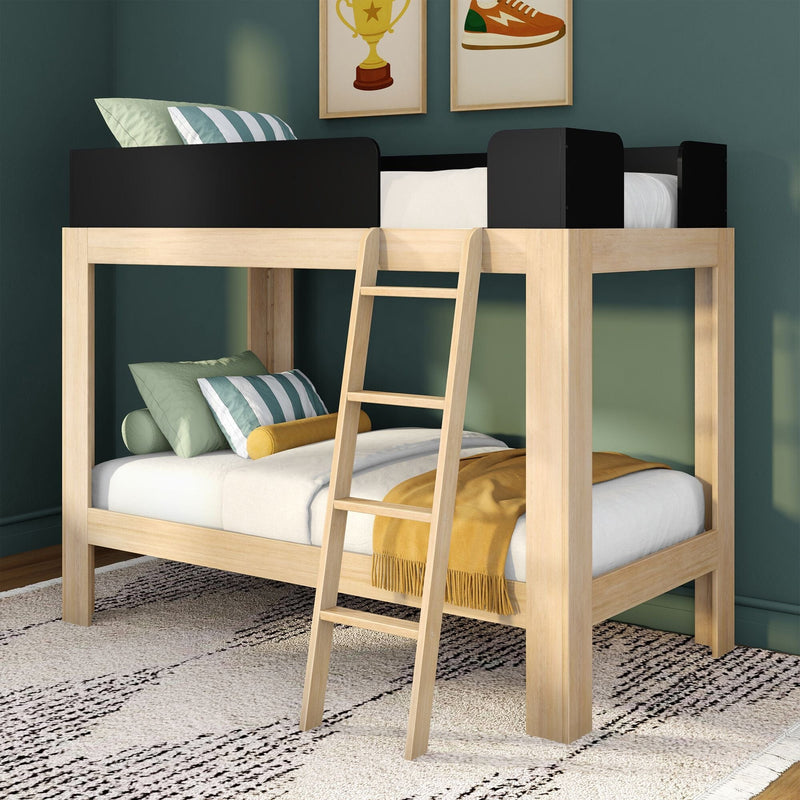 Twin-over-twin natural wood loft bunk bed with ladder and black guardrails in kids' room, striped green pillows and mustard throw on teal walls