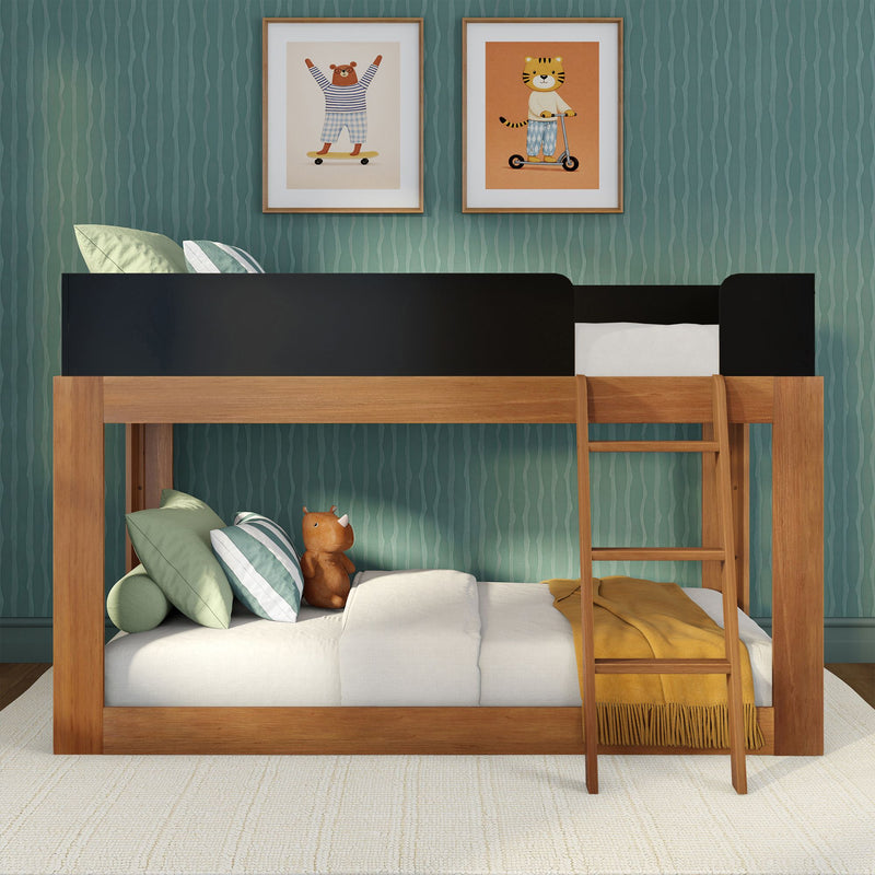 Wooden loft bunk bed in a kids’ bedroom with teal wavy wallpaper, framed animal prints, green striped pillows, plush toy and mustard yellow blanket