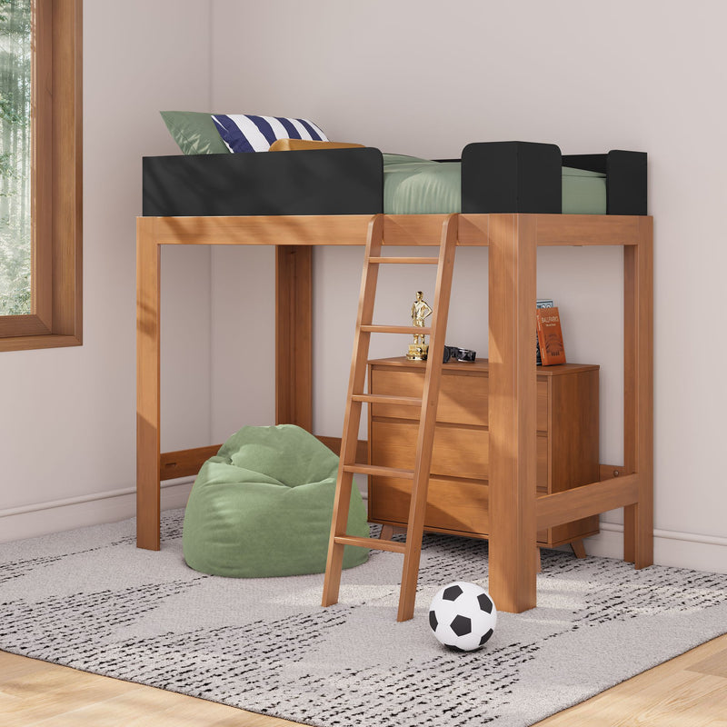 Modern wooden loft bed with ladder and black safety rails over dresser storage, green bedding and striped pillow, green bean bag and soccer ball on gray rug in bright kids' bedroom by window