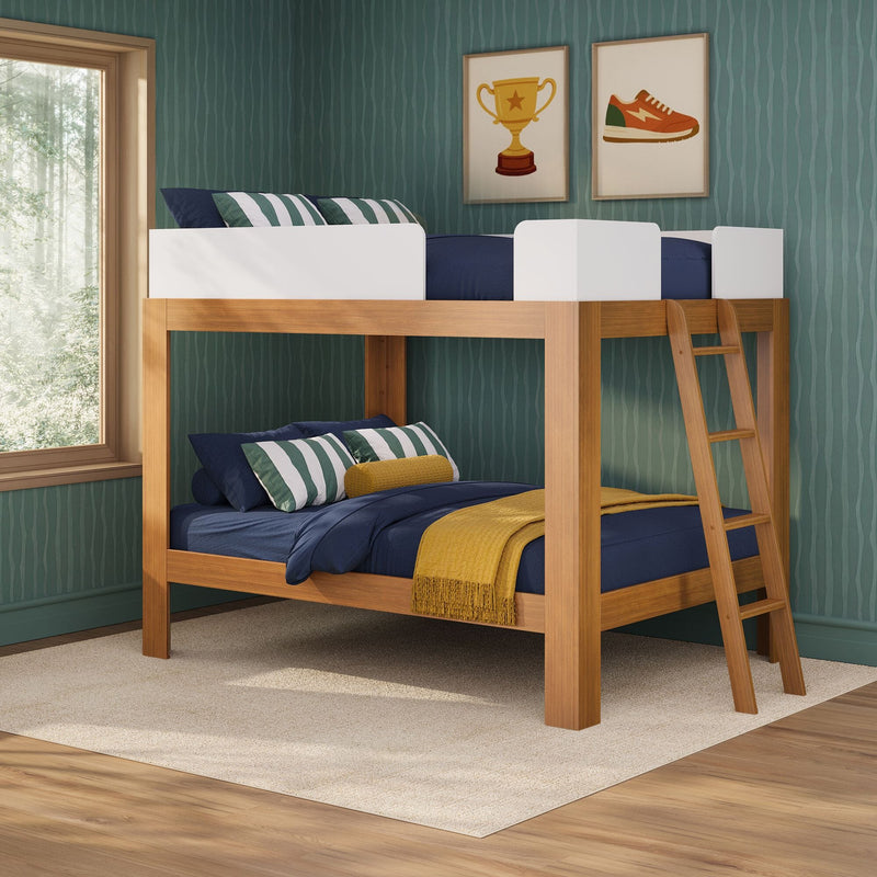 Wooden kids' bunk bed with ladder, navy bedding, green striped pillows and mustard throw on textured wallpaper