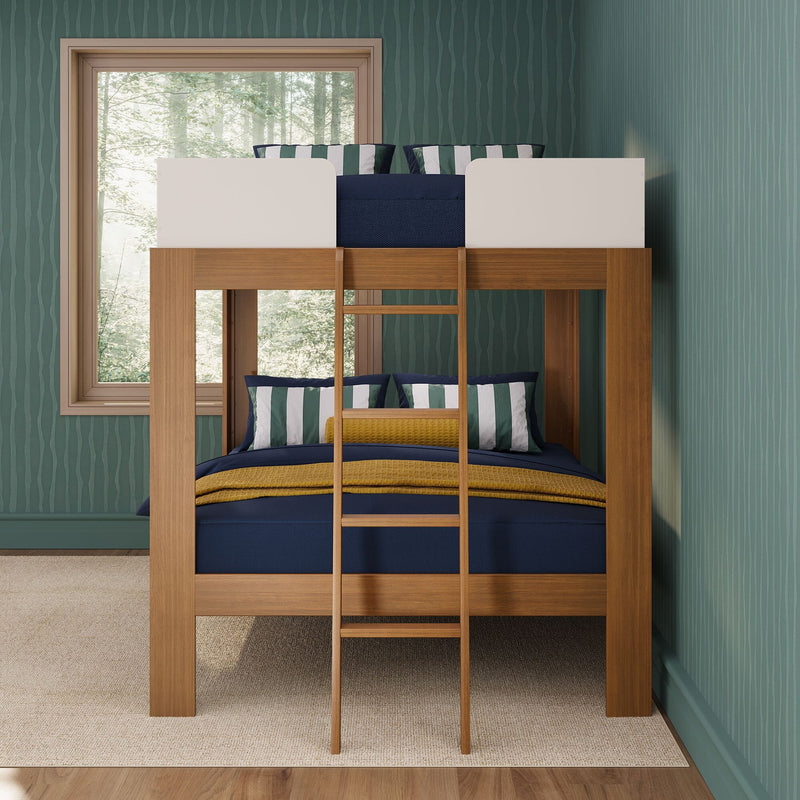 Modern wooden bunk bed with ladder, navy and mustard bedding and striped pillows in a kids' room with green textured wallpaper and forest-view window