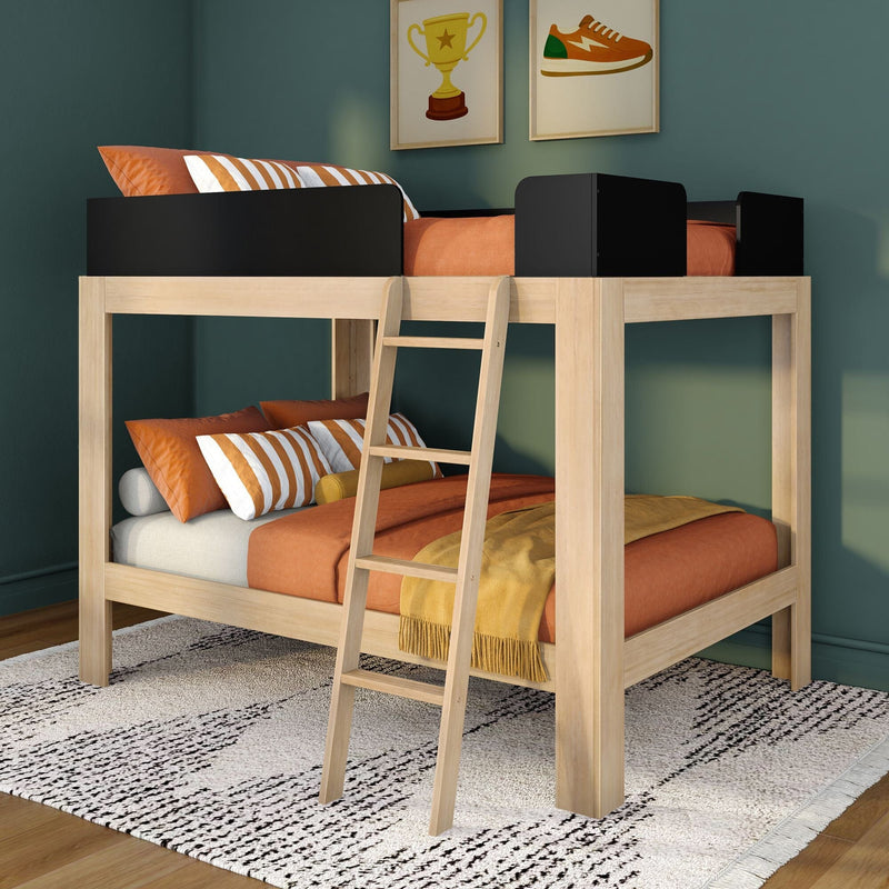 Modern wooden loft bunk bed with ladder, orange linens and striped pillows against a dark green wall with framed trophy and sneaker prints