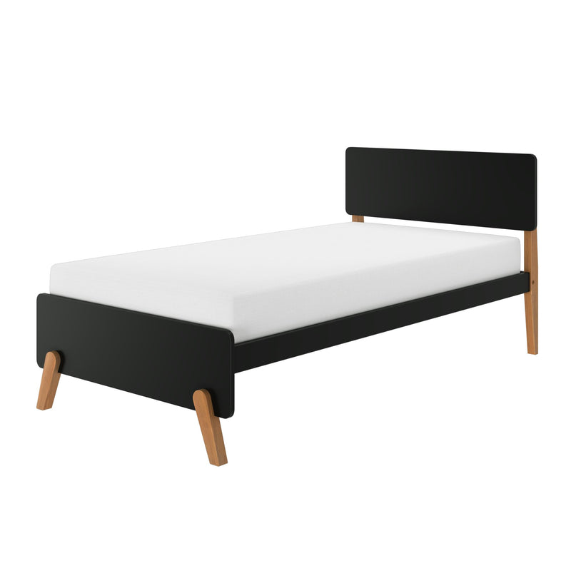 Modern single bed with black headboard and footboard, white mattress and angled wooden legs, minimalist Scandinavian-style bedroom furniture
