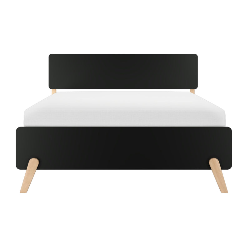 Front view of a modern black wooden headboard with light wood tapered legs and a white mattress on a minimalist mid-century bed frame, isolated on a white background.
