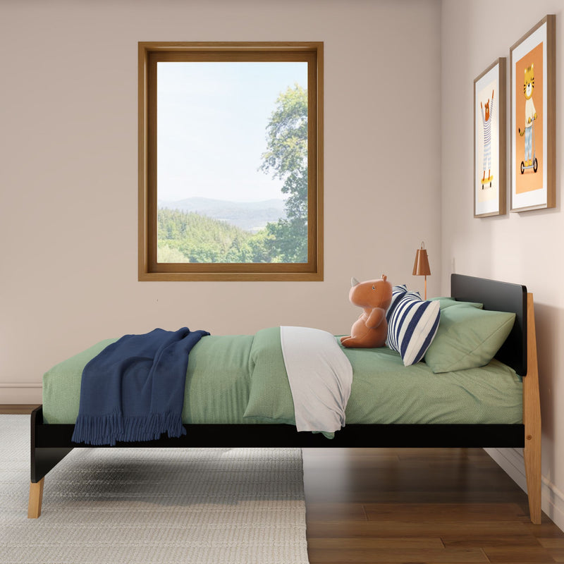 Kids' bedroom with wooden single bed, green bedding, navy throw, striped pillow, plush hippo, wood-framed window with forest view and animal wall art