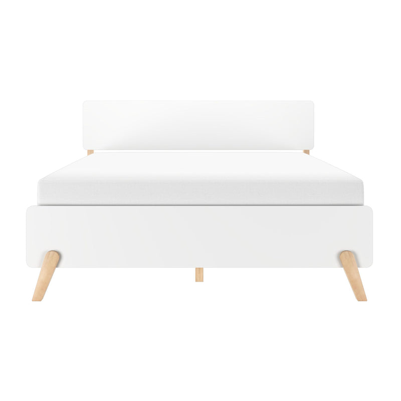 Modern minimalist white platform bed with upholstered headboard and light wooden tapered legs, Scandinavian-style bedroom furniture