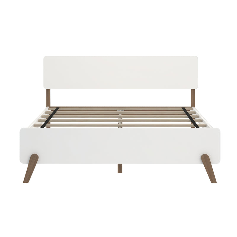White mid-century modern platform bed frame with headboard, slatted wooden base and tapered walnut legs