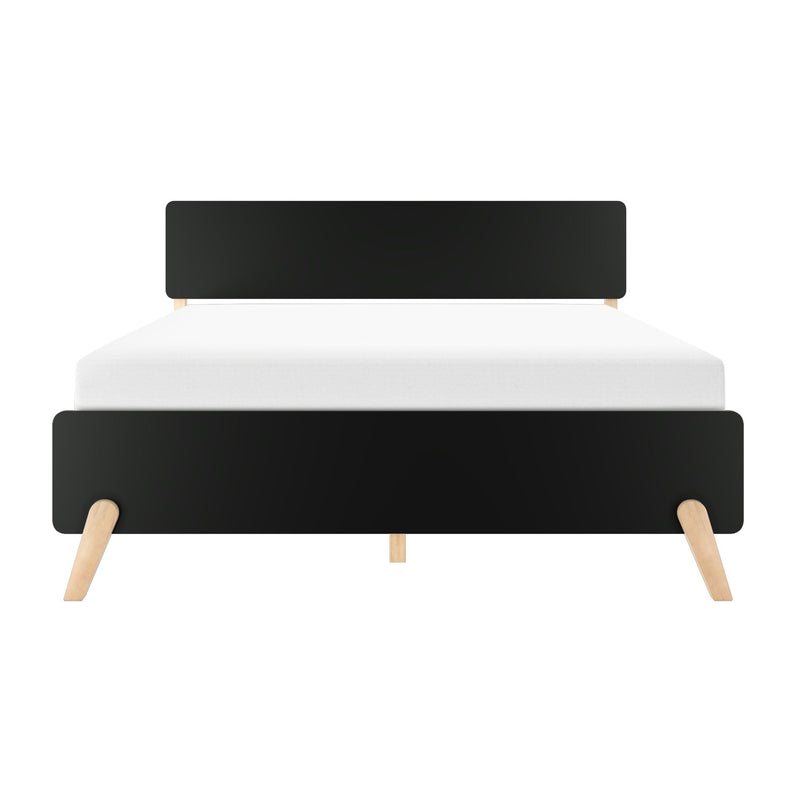 Minimalist mid-century modern black headboard bed frame with angled natural wood legs and white mattress, front view