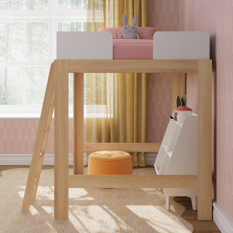 Children's modern wooden loft bed with pink bedding and stuffed bunny, yellow curtains, ladder and pastel nursery decor