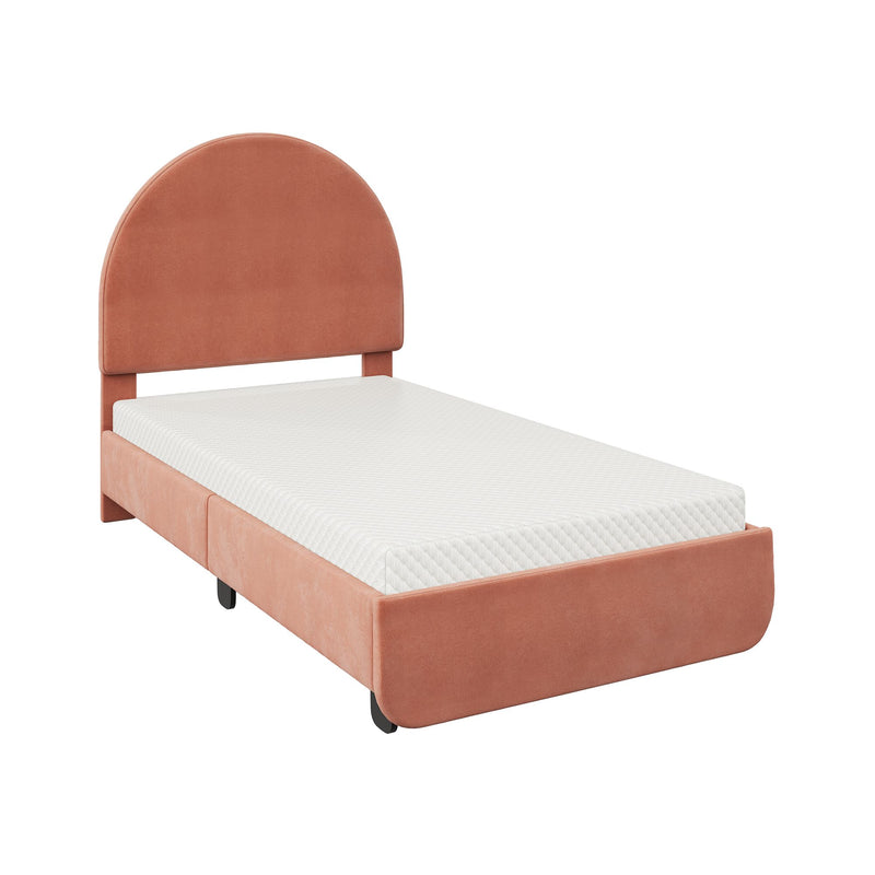 Peach velvet upholstered twin bed with rounded arch headboard and white quilted mattress on a low platform frame, modern bedroom furniture