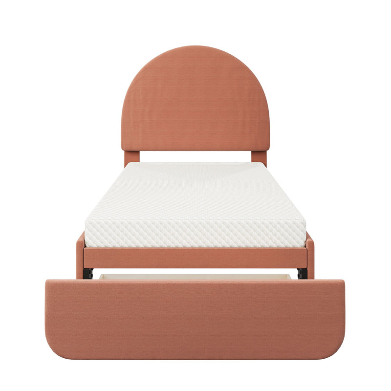 Terracotta upholstered twin platform bed with rounded arched headboard, white mattress and pull-out under-bed storage drawer
