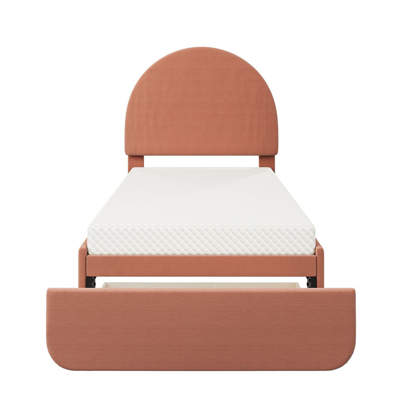 Terracotta upholstered twin platform bed with rounded arched headboard, white mattress and pull-out under-bed storage drawer