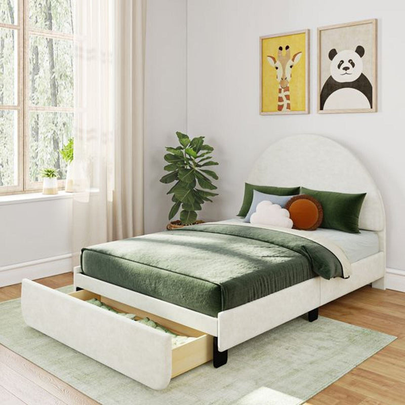 Cozy bedroom with green velvet bed and storage drawer, modern wall art, large window, and lush indoor plant.