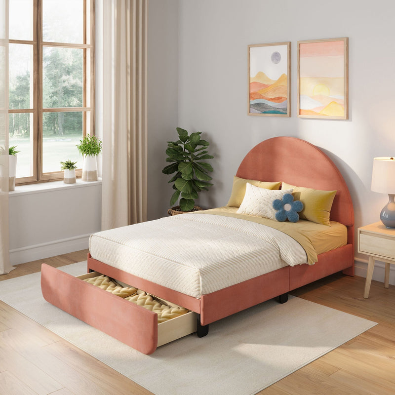 Modern pastel bedroom with coral upholstered single storage bed, cream bedding, large window with beige curtains, potted plants, nightstand lamp and framed abstract wall art
