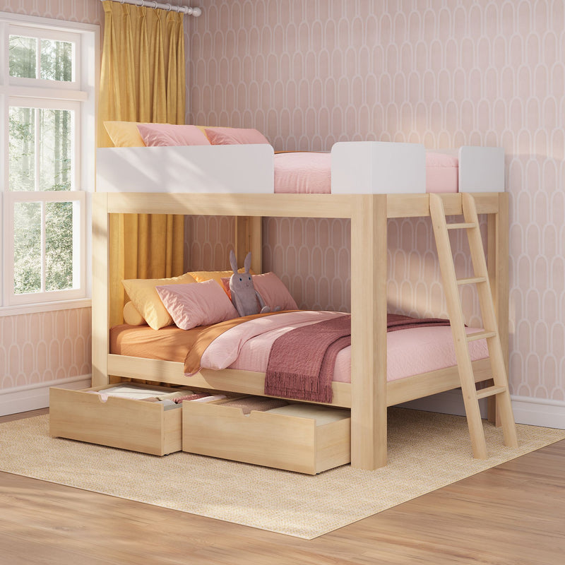 Light wood kids bunk bed with pink bedding, pull-out storage drawers and mustard curtains in a pastel patterned girls' bedroom