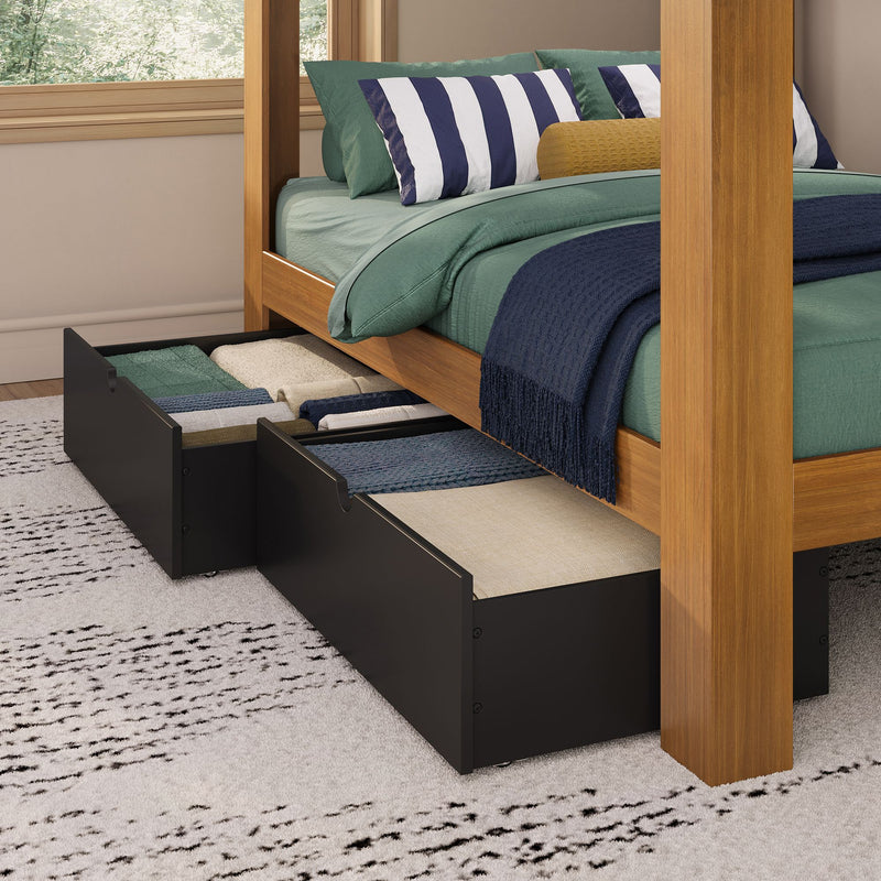 Wooden canopy bed with under-bed storage drawers, green bedding, navy-and-white striped pillows and navy throw — modern bedroom storage solution