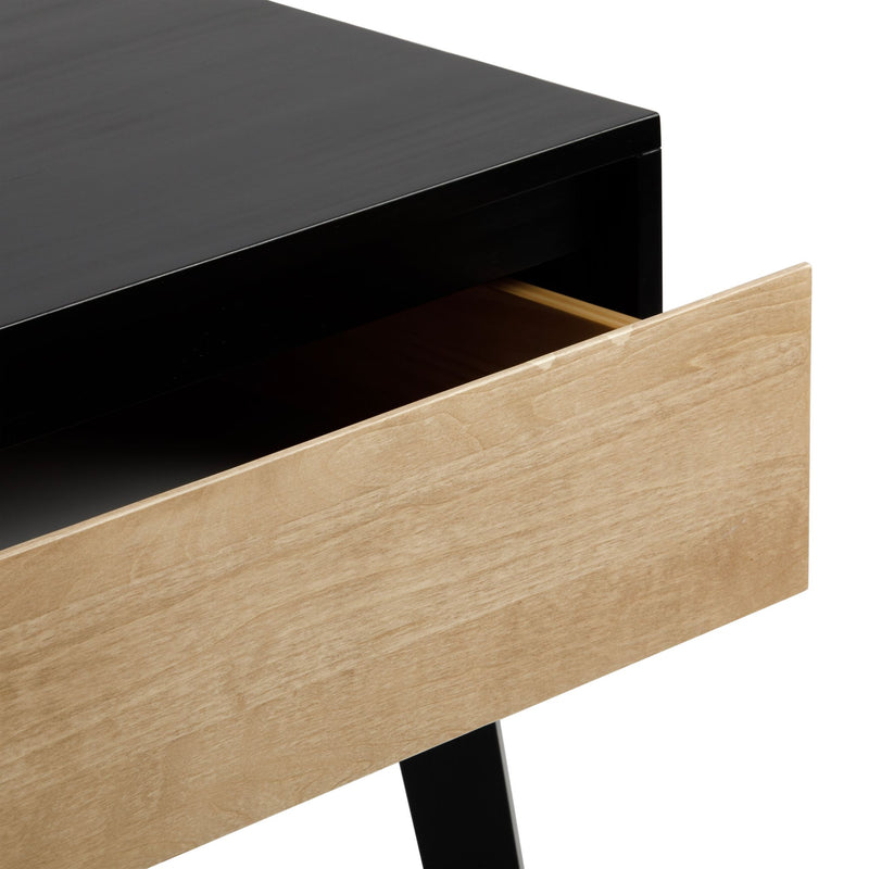 Black modern desk with natural wood storage drawer partially open, minimalist Scandinavian-style bedside table close-up