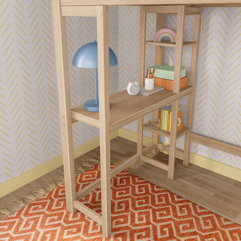 Light wood shelving desk with blue table lamp, white alarm clock, pencil holder, pastel storage boxes, wooden rainbow toy, books, yellow chevron wallpaper and orange geometric rug, children's room decor