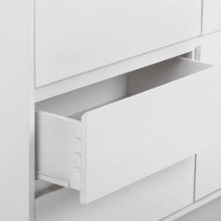 Open white dresser drawer with minimalist design and modern style.