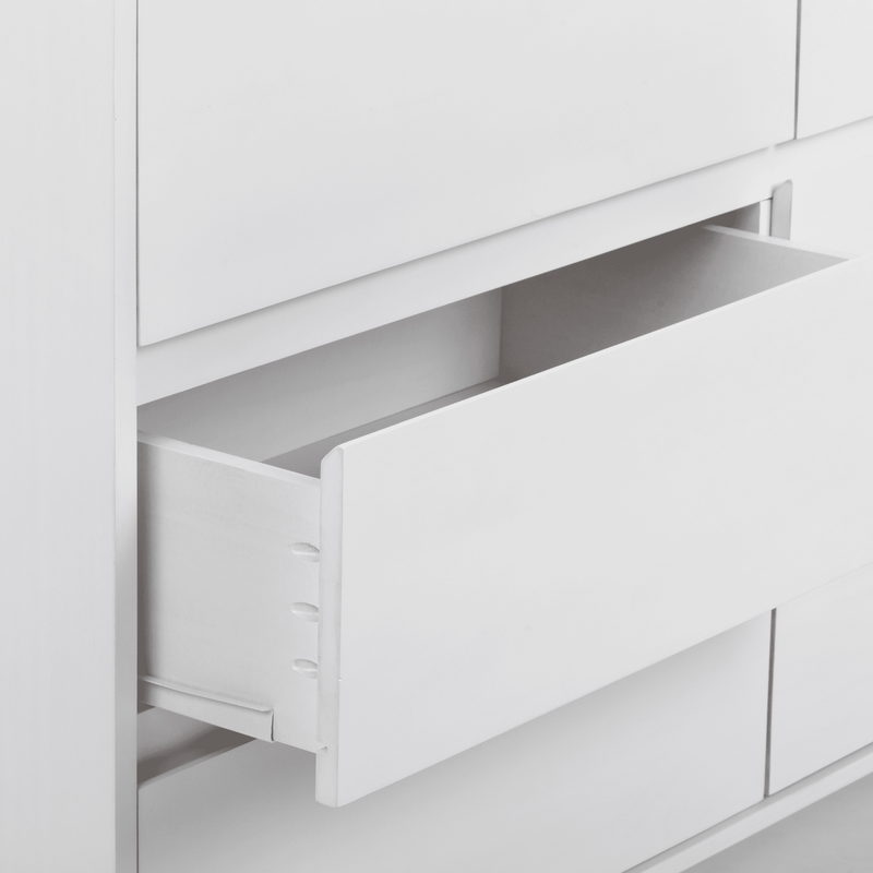 Close-up of white wooden dresser with partially open drawers, modern minimalist bedroom storage furniture