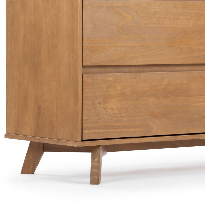 Mid-century modern wooden nightstand with tapered legs and natural oak finish, close-up of drawer fronts and wood grain