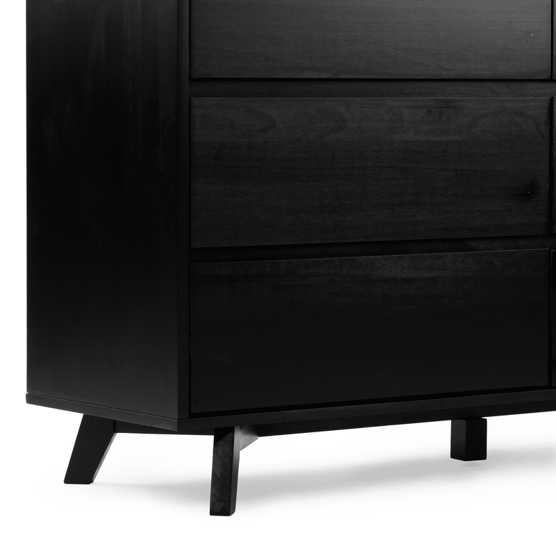 Black wooden mid-century modern bedside table with flat drawer fronts, tapered legs, and matte finish, contemporary bedroom dresser