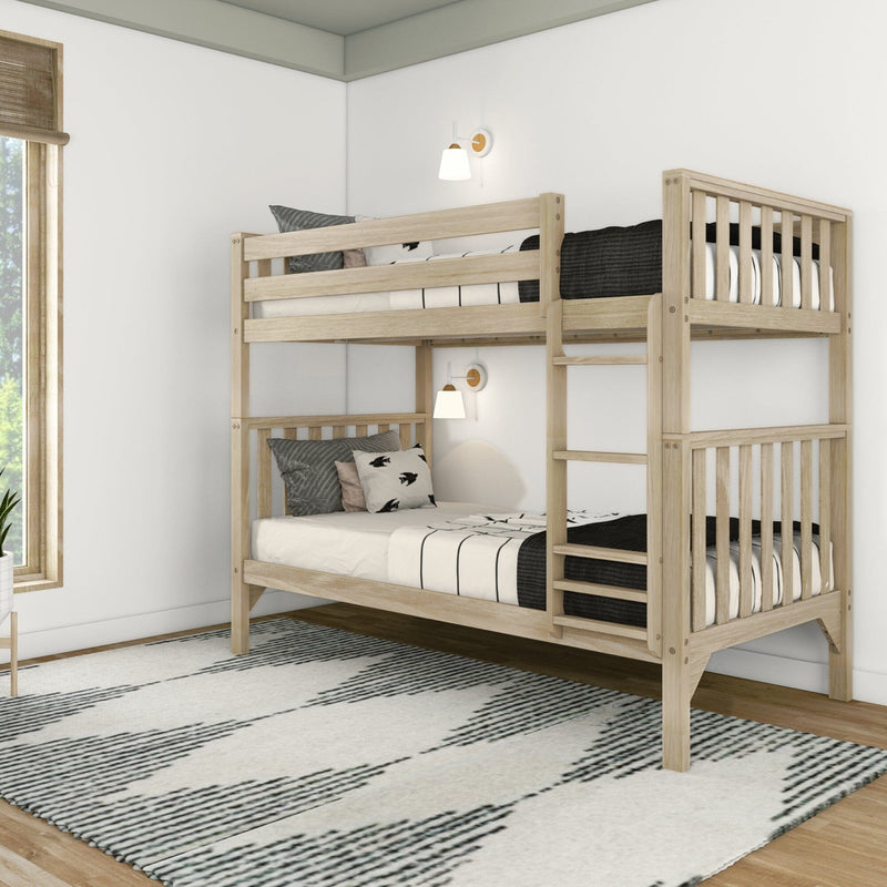 Natural light wood twin-over-twin bunk bed in a modern minimalist kids' bedroom with white walls, ladder and guardrails, black-and-white striped bedding, decorative pillows, wall sconces, woven window shade and patterned area rug