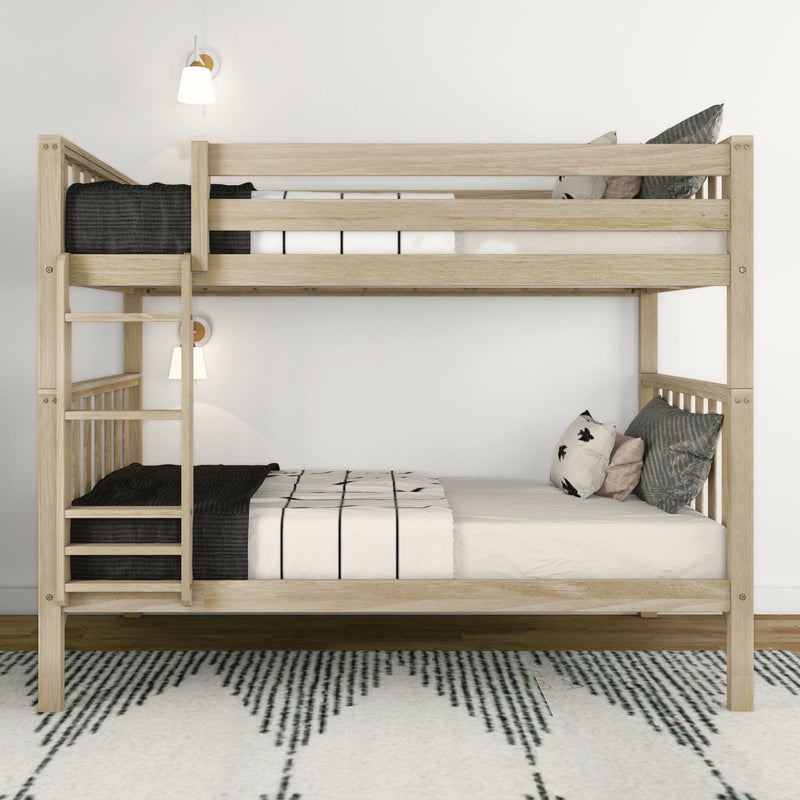 Natural wood bunk bed with ladder, black-and-white bedding and throw pillows, wall sconces and rug in a minimalist Scandinavian kids’ bedroom