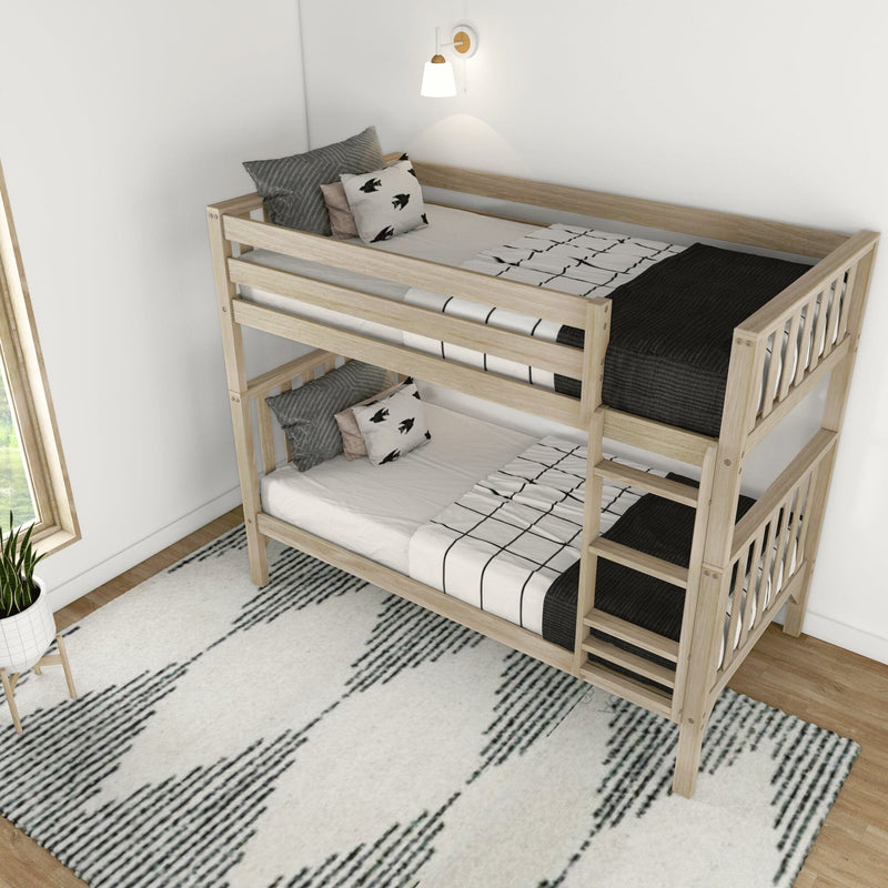 Natural wood bunk bed in modern minimalist kids bedroom with black-and-white bedding, patterned rug and wall sconce