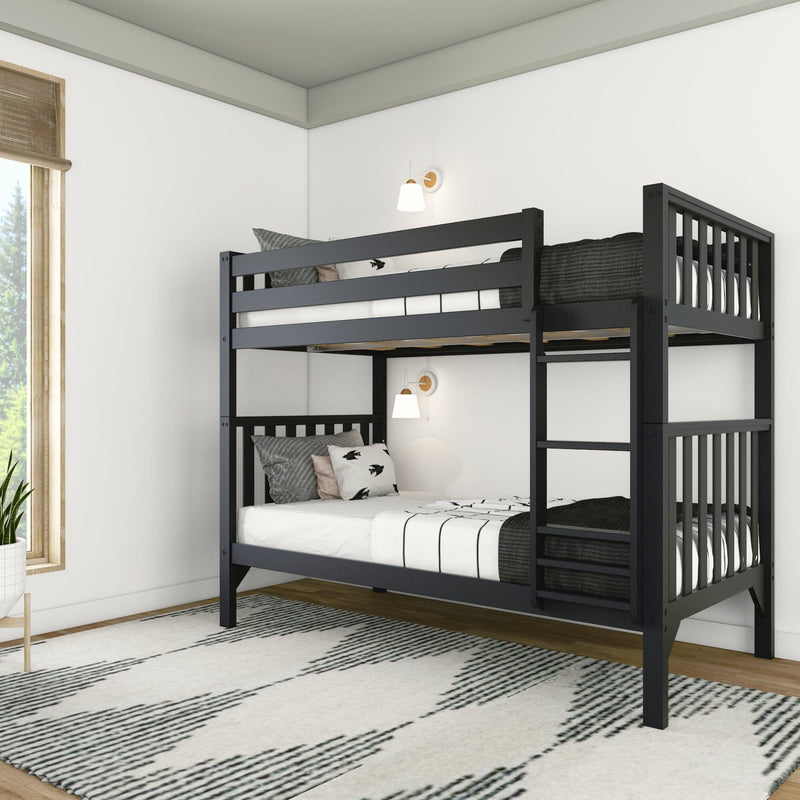 Black wooden bunk bed in a modern kids' bedroom with white walls, striped bedding and decorative pillows, wall sconces, patterned area rug and hardwood floors by a window with bamboo blinds