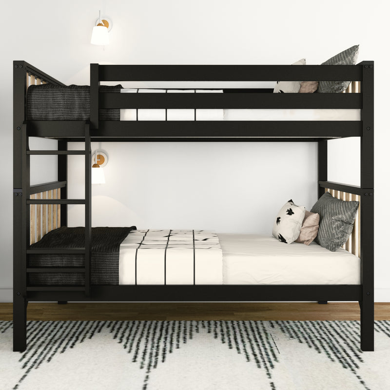 Black twin-over-twin loft bunk bed with ladder and safety rails, solid wood frame, white bedding and decorative pillows in modern kids' bedroom