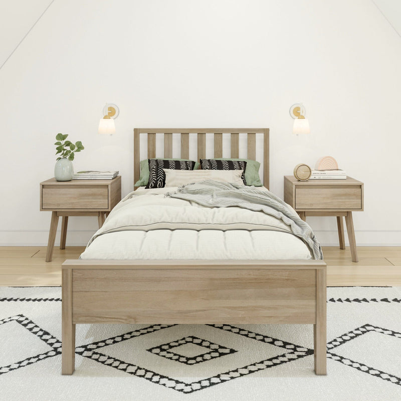 Minimalist Scandinavian bedroom with natural wood bed frame, matching nightstands, neutral bedding, patterned rug, wall sconces and green plant