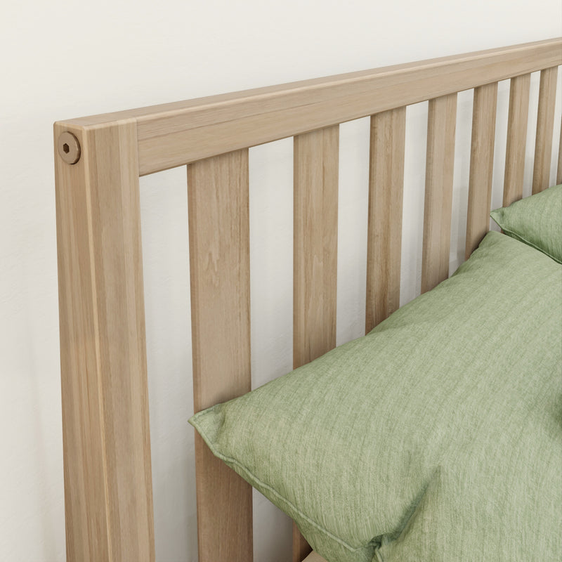 Close-up of light oak slatted wood bed headboard with green linen pillow, modern minimalist bedroom decor