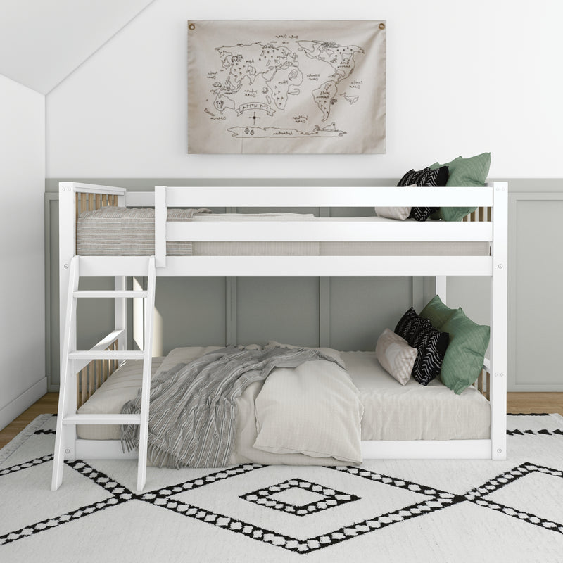 White wooden bunk bed with ladder in a modern kids room, neutral linen bedding, green accent pillows and world map wall art