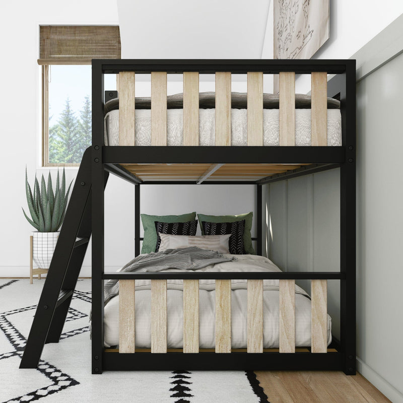 Modern black metal frame bunk bed with light wood slats in a bright minimalist bedroom, ladder, green and patterned pillows, potted succulent and geometric rug