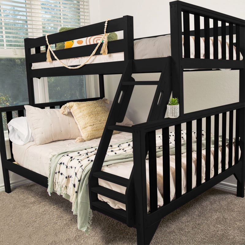 Black wooden loft bunk bed with ladder, beige bedding and woven pillows, decorative bead garland and small potted succulent on railing in a bright carpeted kids' bedroom