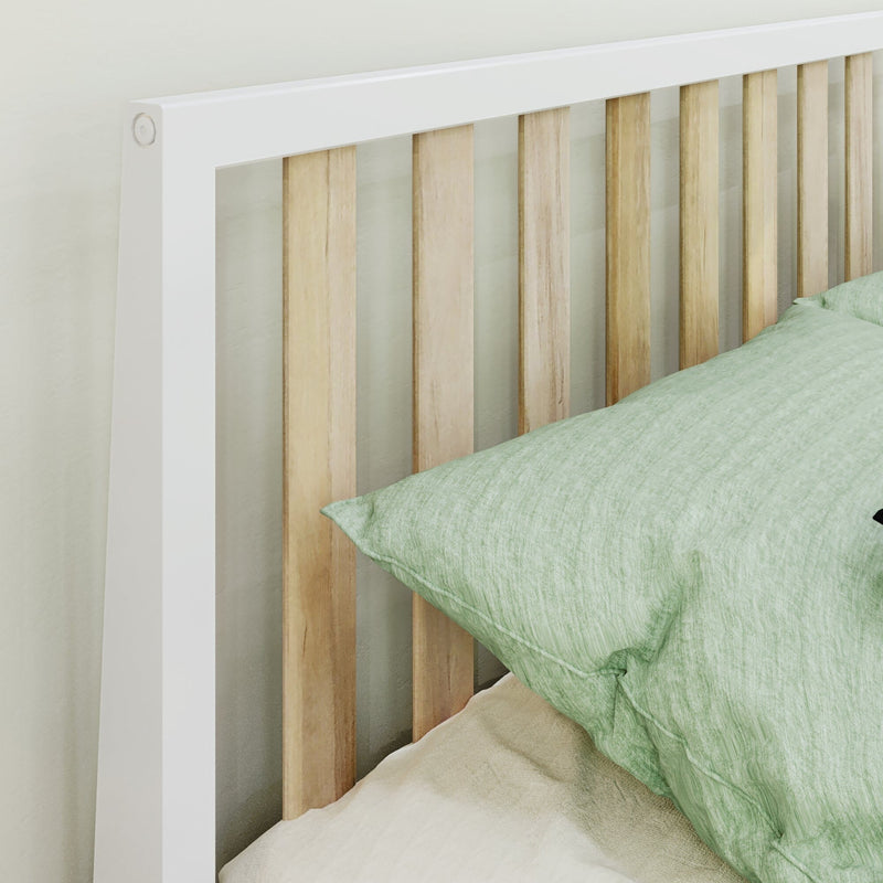 Modern white-framed wooden slat headboard with natural wood slats and green linen pillow on bed, minimalist bedroom decor