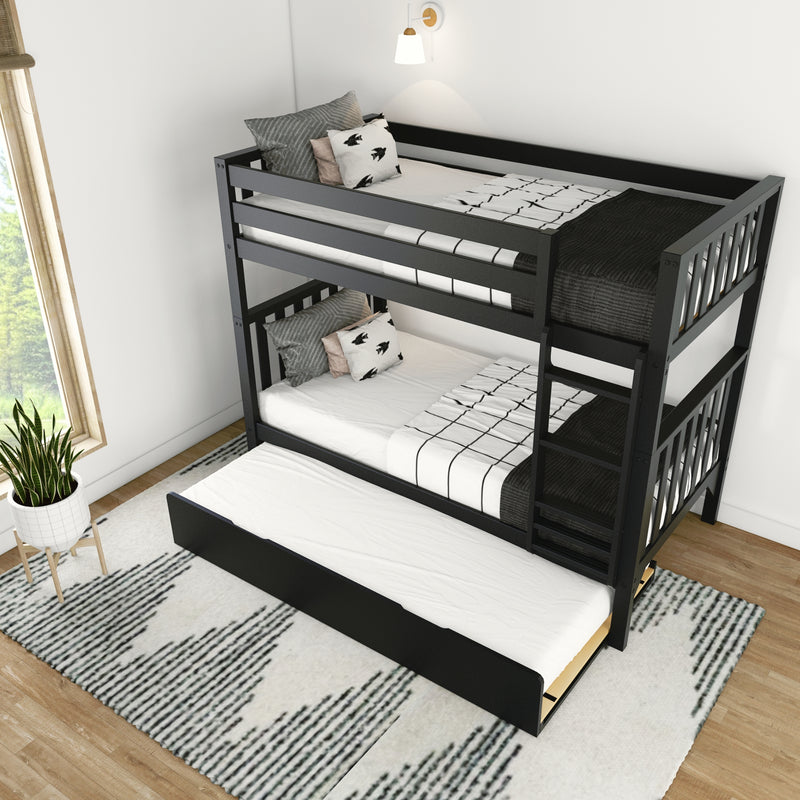 Black wooden twin bunk bed with pull-out trundle, black-and-white patterned bedding and decorative pillows in a bright modern kids' bedroom