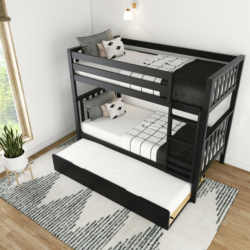 Black wooden twin bunk bed with pull-out trundle, black-and-white patterned bedding and decorative pillows in a bright modern kids' bedroom