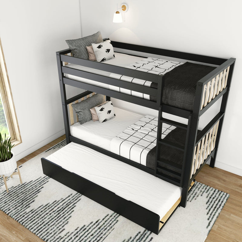 Black metal bunk bed with pull-out trundle, white grid-pattern bedding, bird-print and gray pillows, wooden slats, wall sconce and patterned rug in a modern kids’ bedroom