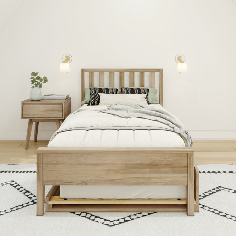 Minimalist Scandinavian bedroom with light wood bed frame, white bedding, patterned pillows, nightstand, wall sconces, plant