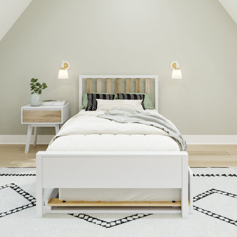 Minimalist bedroom interior with white wooden bed, green and patterned pillows, white nightstand with vase and books, and modern wall sconces on neutral walls