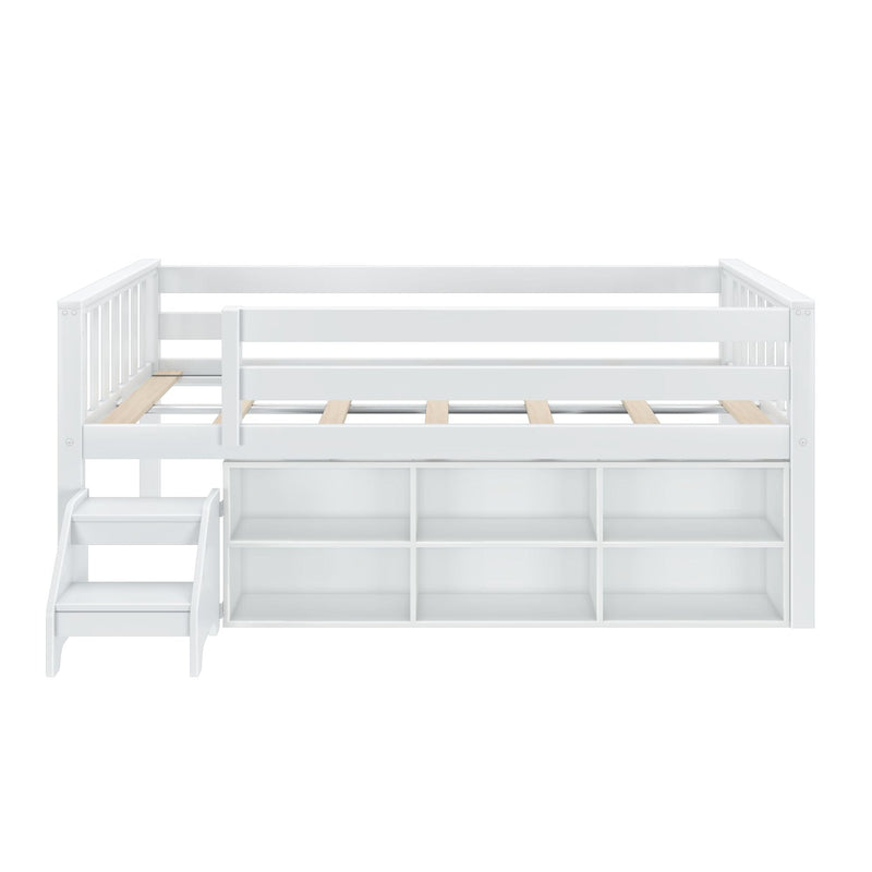 White wooden loft bed with guardrails, slatted mattress platform, built-in storage cubbies and attached staircase